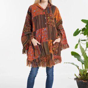 Kathmandu unisex hooded poncho with pockets
